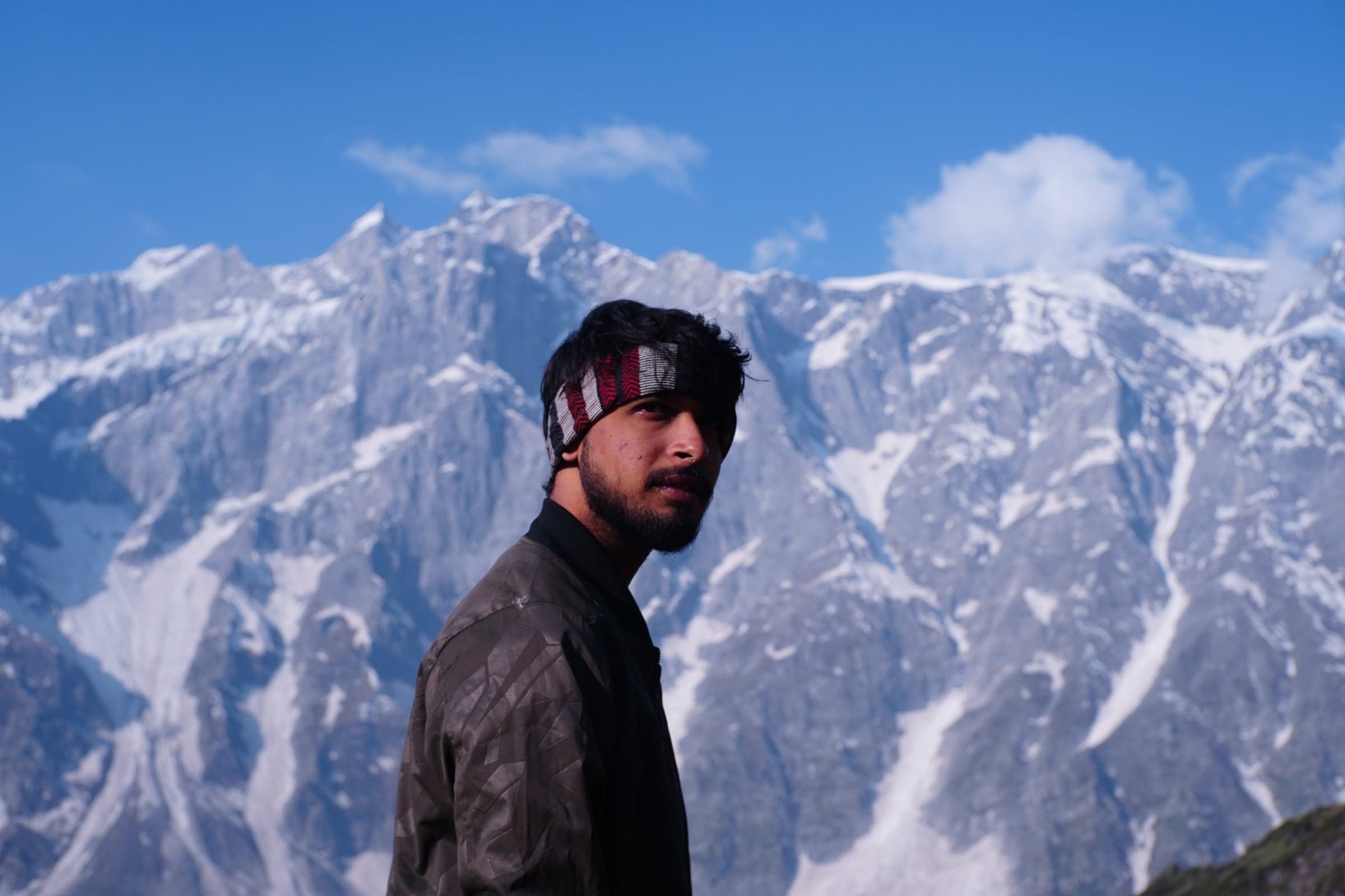 Bhanu Pratap Singh, founder of Mrigtrishna Trails, in front of snow-covered mountains